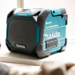 DMR203-MAKITA-18V-12Vmax-Cordless-Job-Site-Speaker-1 DMR203 MAKITA 18V/ 12Vmax Cordless Job Site Speaker in use displaying portable Bluetooth audio technology